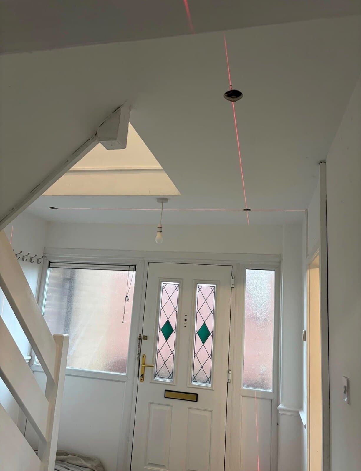 Downlight positions set out with a laser level before any holes are cut
